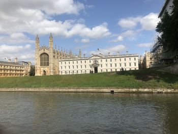 Buildings against cloudy sky