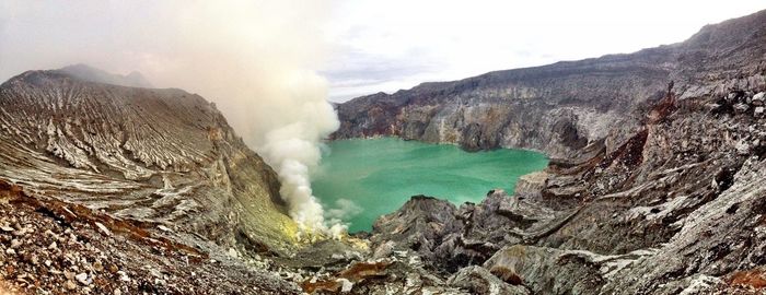 Ijen volcano at lake by mountain