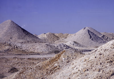 Rock formations at desert against sky