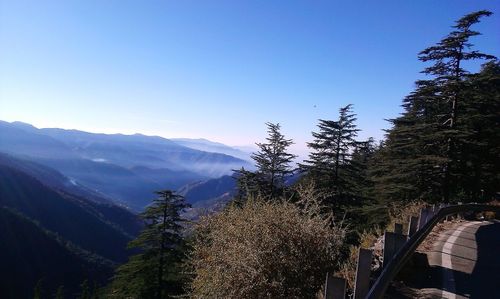 Scenic view of mountains against clear blue sky