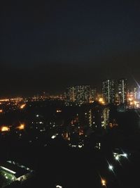 Illuminated cityscape at night