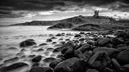 Scenic view of sea against cloudy sky