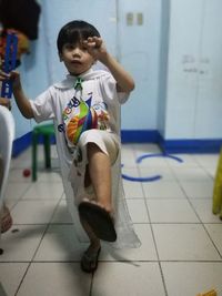 Boy standing in bathroom