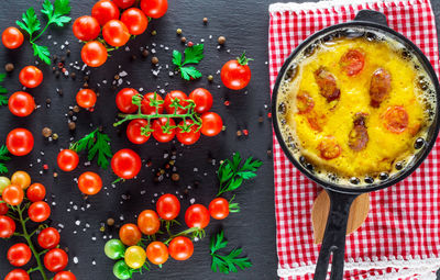 Directly above shot of tomatoes and spices on table