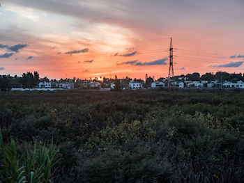 Scenic view of landscape against sky at sunset