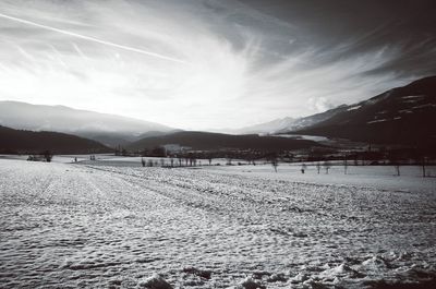 Scenic view of landscape against sky during winter