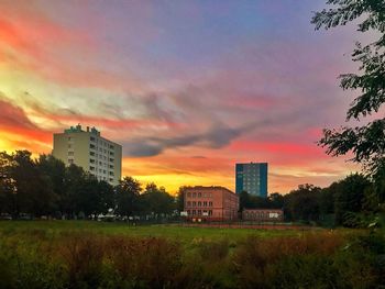 Buildings against sky during sunset