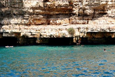 People swimming in sea