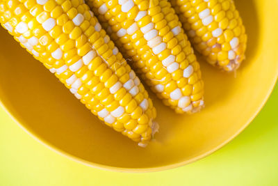 High angle view of yellow eggs in bowl