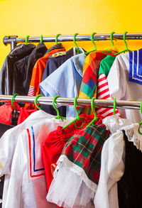 Clothes hanging on rack in store