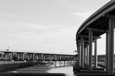 View of bridge against cloudy sky