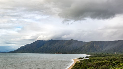 Scenic view of mountains against cloudy sky