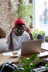 Depressed man sitting at cafe