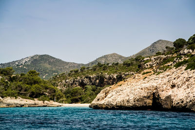 Scenic view of sea with mountains in background