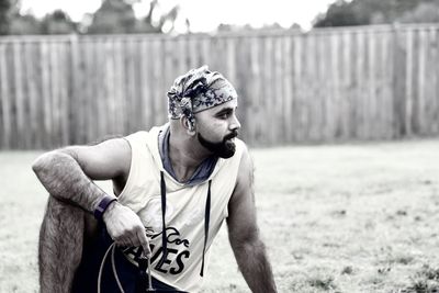 Thoughtful man sitting in yard