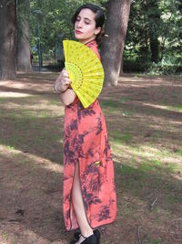 Young woman standing on field