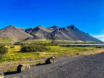 Scenic view of landscape against clear blue sky