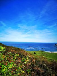 Scenic view of sea against blue sky