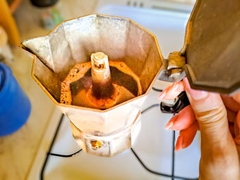 Close-up of hand holding coffee