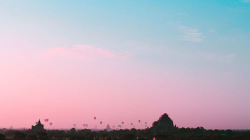 Silhouette trees against sky during sunset