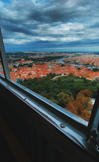 Aerial view of city seen through window of building