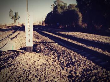 Close-up of railroad track against sky