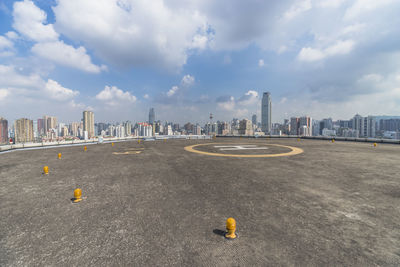 Panoramic shot of buildings against sky in city