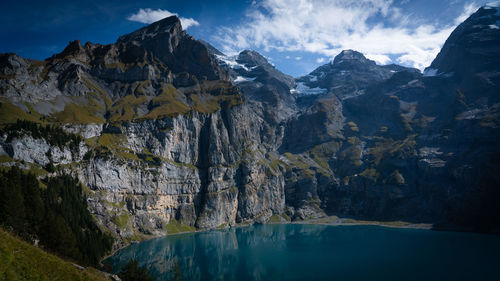 Panoramic view of sea and mountains against sky