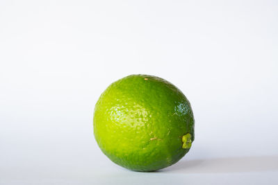 Close-up of lemon against white background