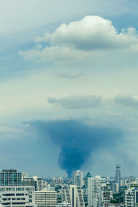 Huge explosion and fire at plastic factory on outskirts of town, thick black smoke filled sky