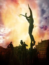 Low angle view of statue against cloudy sky