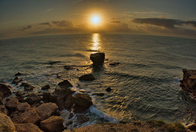 Scenic view of sea against sky during sunset