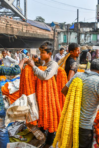 People at street market in city