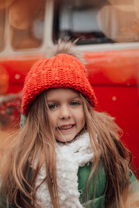 Portrait of young woman in car