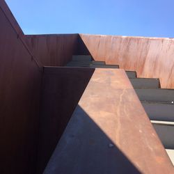 Low angle view of building against clear blue sky