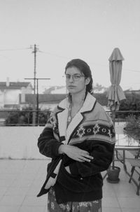 Portrait of man standing against sky