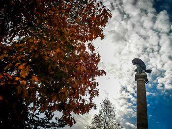 Low angle view of statue against cloudy sky