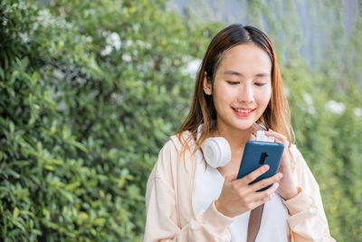 Young woman using mobile phone