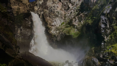 Scenic view of waterfall in forest