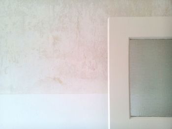 Close-up of wall with closed door