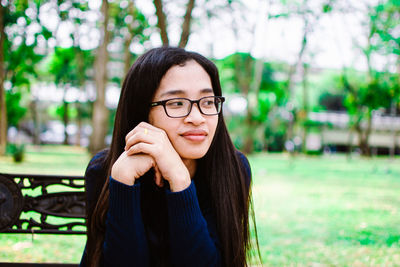 Young woman sitting at park