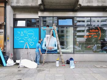 Man with text on wall in city