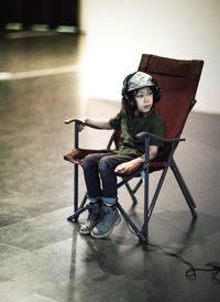 Young woman sitting on chair