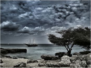 Scenic view of sea against cloudy sky