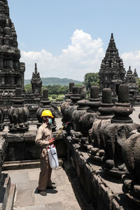 Full length of man outside temple against building