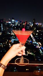 Close-up of hand holding wineglass