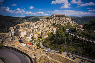 High angle view of town against cloudy sky