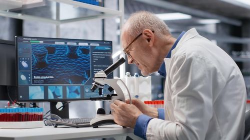 Side view of man working in office