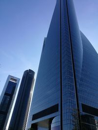 Low angle view of skyscrapers against clear sky