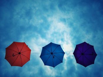 Low angle view of umbrella against sky